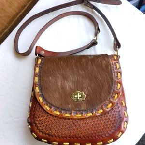 Shoulder bag, embossed leather and hair-on.